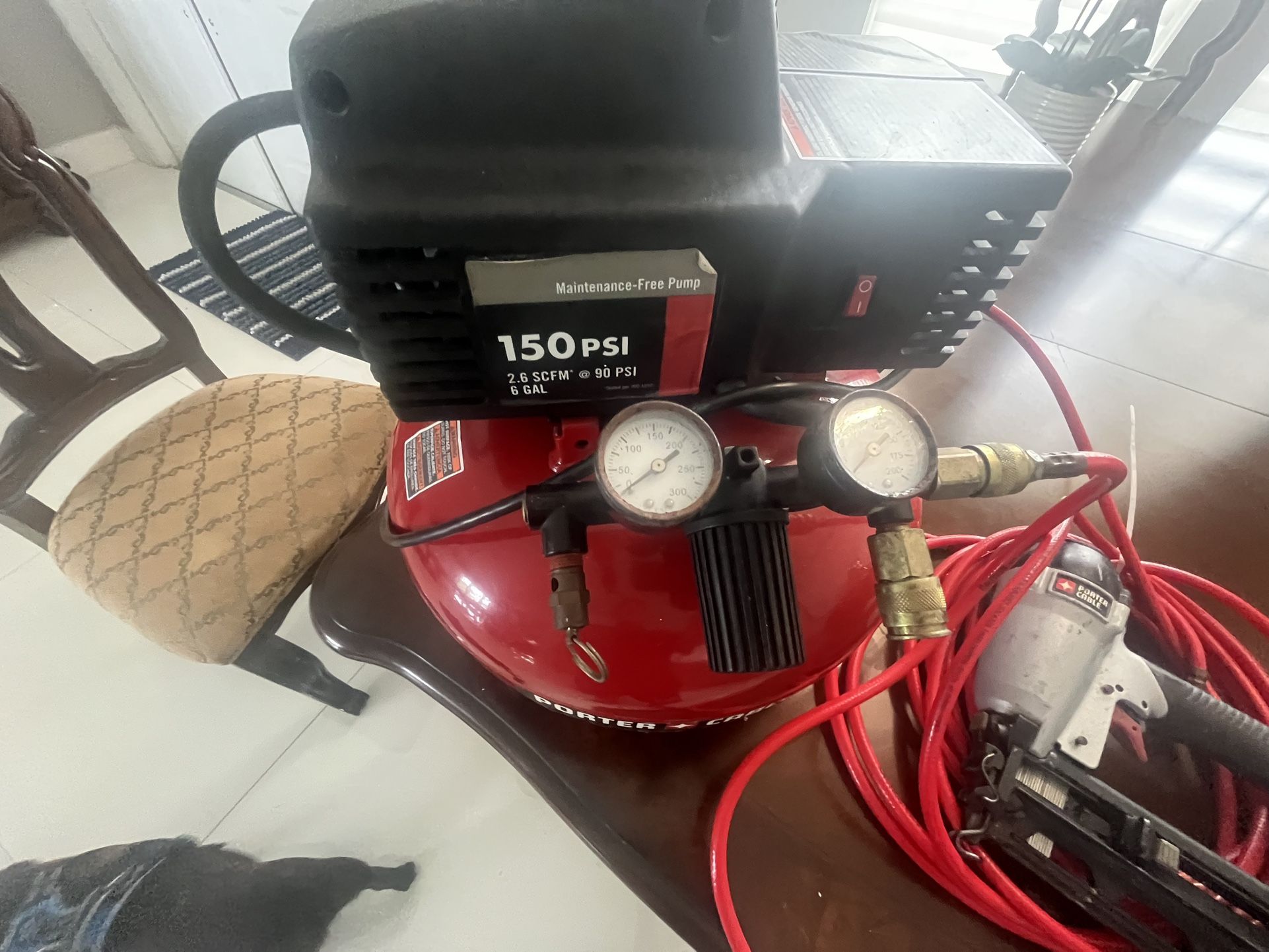 Porter Cable Air Compressor 6 Gallon With Hose And a Nail Gun