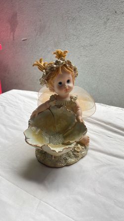 Gold Fairy with flower