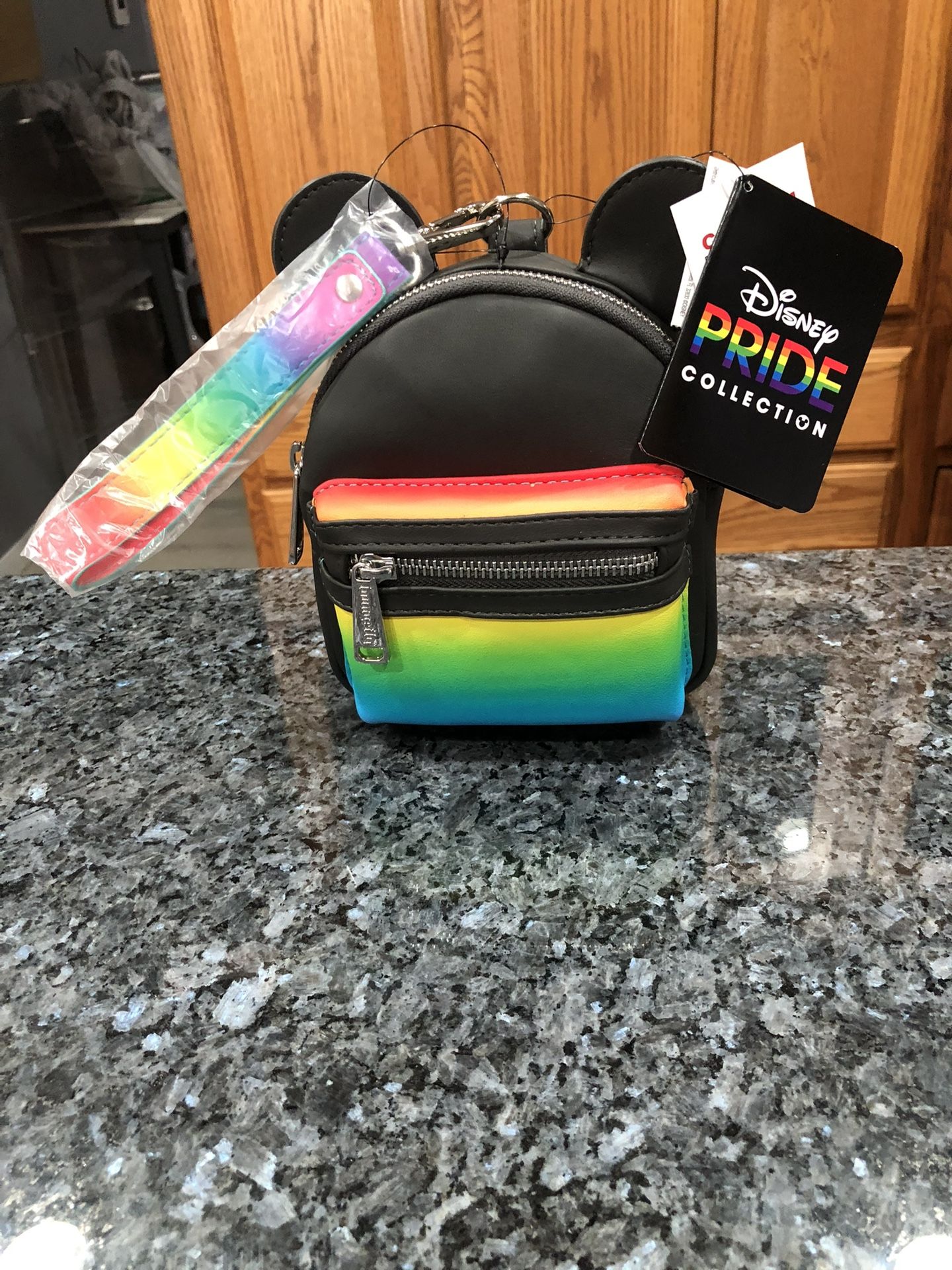 Disney Parks Pride Collection Mickey Mouse Loungefly Wristlet Brand New With Tags . Size 6 inches tall with ears 7 1/2 inches tall and 5 1/2 inches w