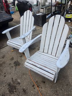 Price is firm. Two solid cedar Adirondack chairs