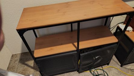 Ikea brand shelving with iron grate doors