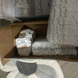 Two Items* Newborn Diaper, And A Bath Flower