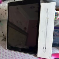 iPad with original apple pencil together 
