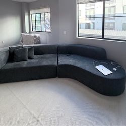 Grey curved sofa