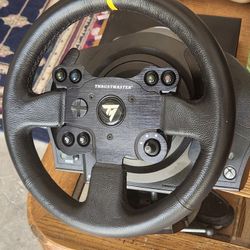 Thrust master T 300 base and leather wheel.