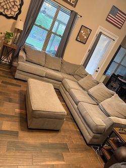 Gray sectional and ottoman