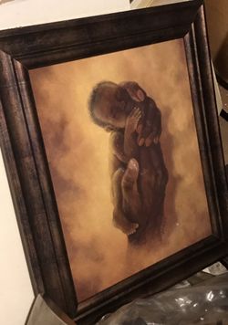Framed art baby with holding hands