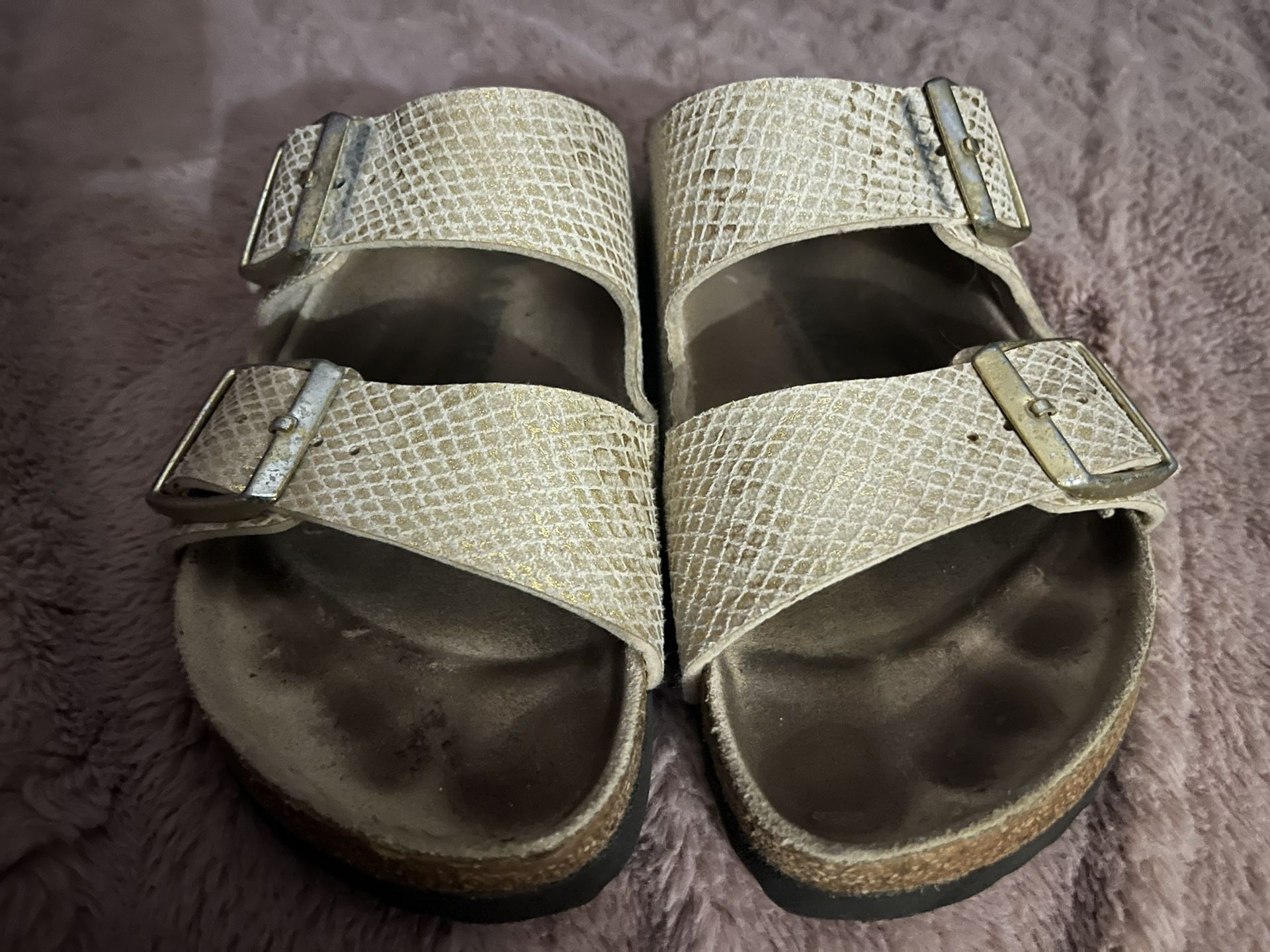 Birkenstock’s Double Strap Metallic Gold/Beige Snake Detail Sandals