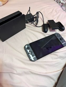 OLED Nintendo Switch (Left Joycon came off, still functional)