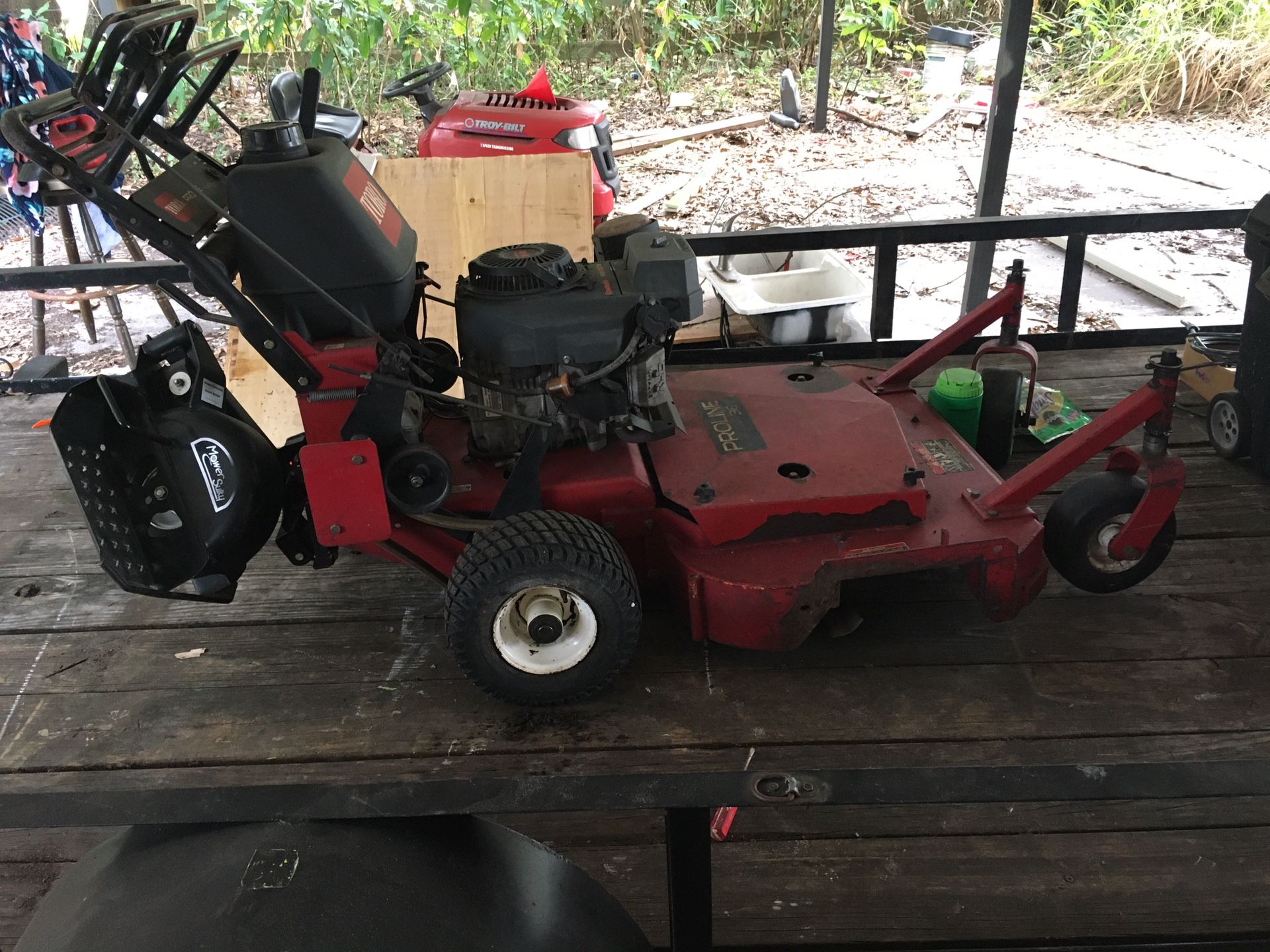 Toro Pro line 36 walk behind lawn mower, ride along attachment included