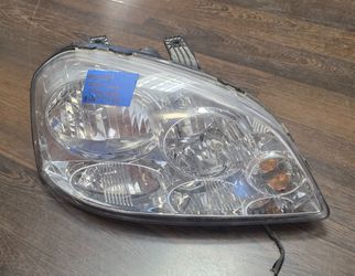 USED REF#1435 2004-2007 CHEVY OPTRA PASSENGER SIDE HEADLIGHT