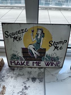 “Squeeze Me Stomp Me Make Me Wine” sign