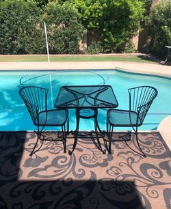 Patio set. Table and chairs. Carolina Iron. Very nice condition.