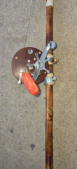 Vintage fishing, reel and pole.Original thirty bucks