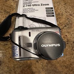 Olympus Camedia C-740 Ultra Zoom Camera With XD Memory Card, Camera Case, Cord To Transfer Photos, Instruction Manual and CD