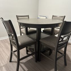 PRICE DROP: DINING TABLE AND 4 CHAIRS