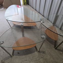 Three glass tables, one lage coffee table with two side tables
Small 29"x21 - 21 hight 
Large 55"x33-15 hight 
