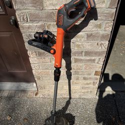 Black & Decker battery powered 20 volt string trimmer with charger and 2 batteries