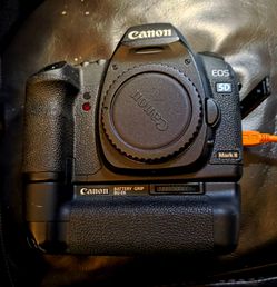 Canon EOS 5D Mark II digital SLR camera equipped with a BG-E6 battery grip.