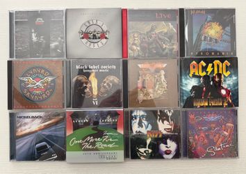 Rock and Metal CD’s with brand new portable CD player. KISS, AC/DC, Guns and rose, lynyrd skynyrd