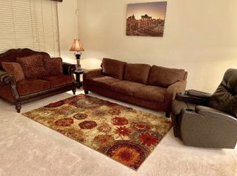 Selling area rug, 2 couches and recliner