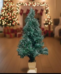 Christmas tree, about 33" tall 🎄
Sturdy and set inside a decorative pot.
Features color-changing multicolor lights running along its length ✨
