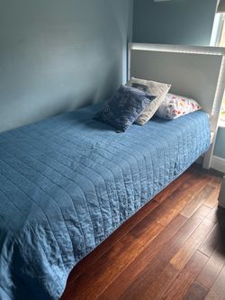 Twin size bed for sale, has light around headboard, convenient for bed time stories