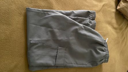 Young man’s gray trousers