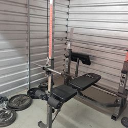 300lb olympic weight set with bench/squat rack combo