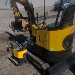 New mini excavator  15 HP Gas Motor and a concrete breaker attachment available