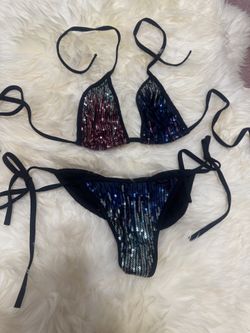 Eye-catching triangle bikini with multicolor sequin panels and black tie straps. Designed for a flattering fit and adjustable comfort. Shimmering sequ