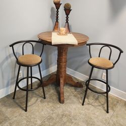 Pub style, round oak pedestal table. And 2 Chairs