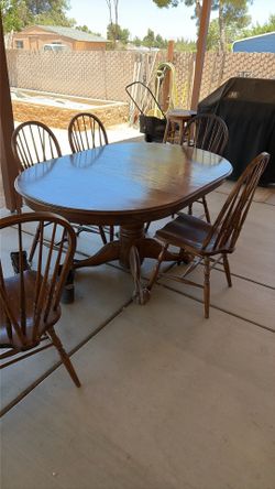 Solid oak ball and claw table and five chairs