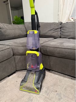 This is a BISSELL TurboClean PowerBrush Pet Carpet Cleaner in green