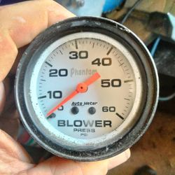 White-faced Auto Meter Phantom Blower Gauge.