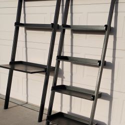 Beautiful black set in great condition. Includes: • 1 ladder-style leaning wall shelf with plenty of storage • 1 leaning wall shelf combined with a de