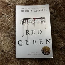 One paper back book; Red Queen by Victoria Aveyard 