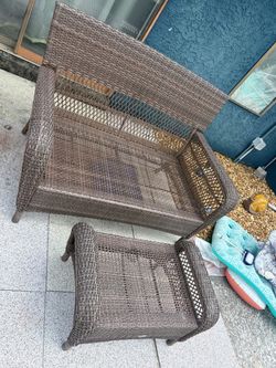 Outdoor wicker couch and ottoman
