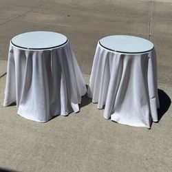 2 Glass Topped End Tables 24” T  20” Diameter 