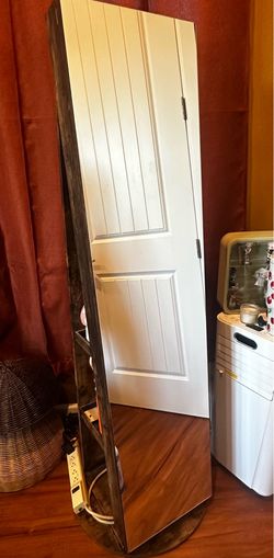 Swivel jewelry cabinet w/ mirror