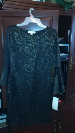 New black dress with flower design. Size 6.