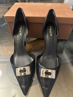 black and gold coach heels