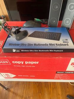 Paper/keyboard/speakers/web cam/mouse