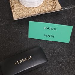 Botega Veneta and Versace sunglass cases empty