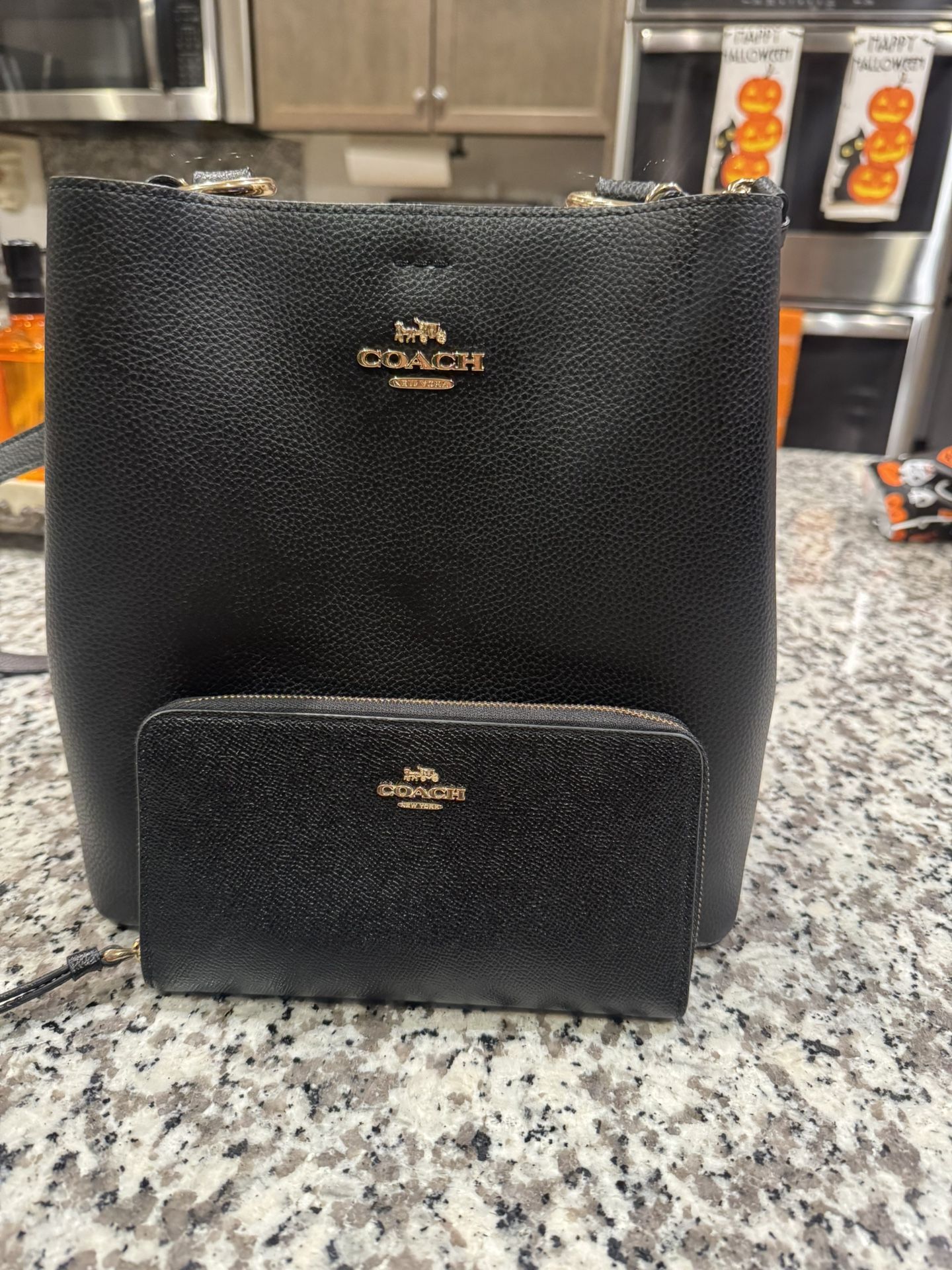 COACH2WAY shoulder bag black 91122 with wallet please look at photos the sides of the purse just were repaired not noticeable.Beautiful and very clean