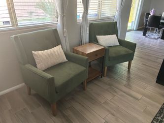 2 green accent chairs