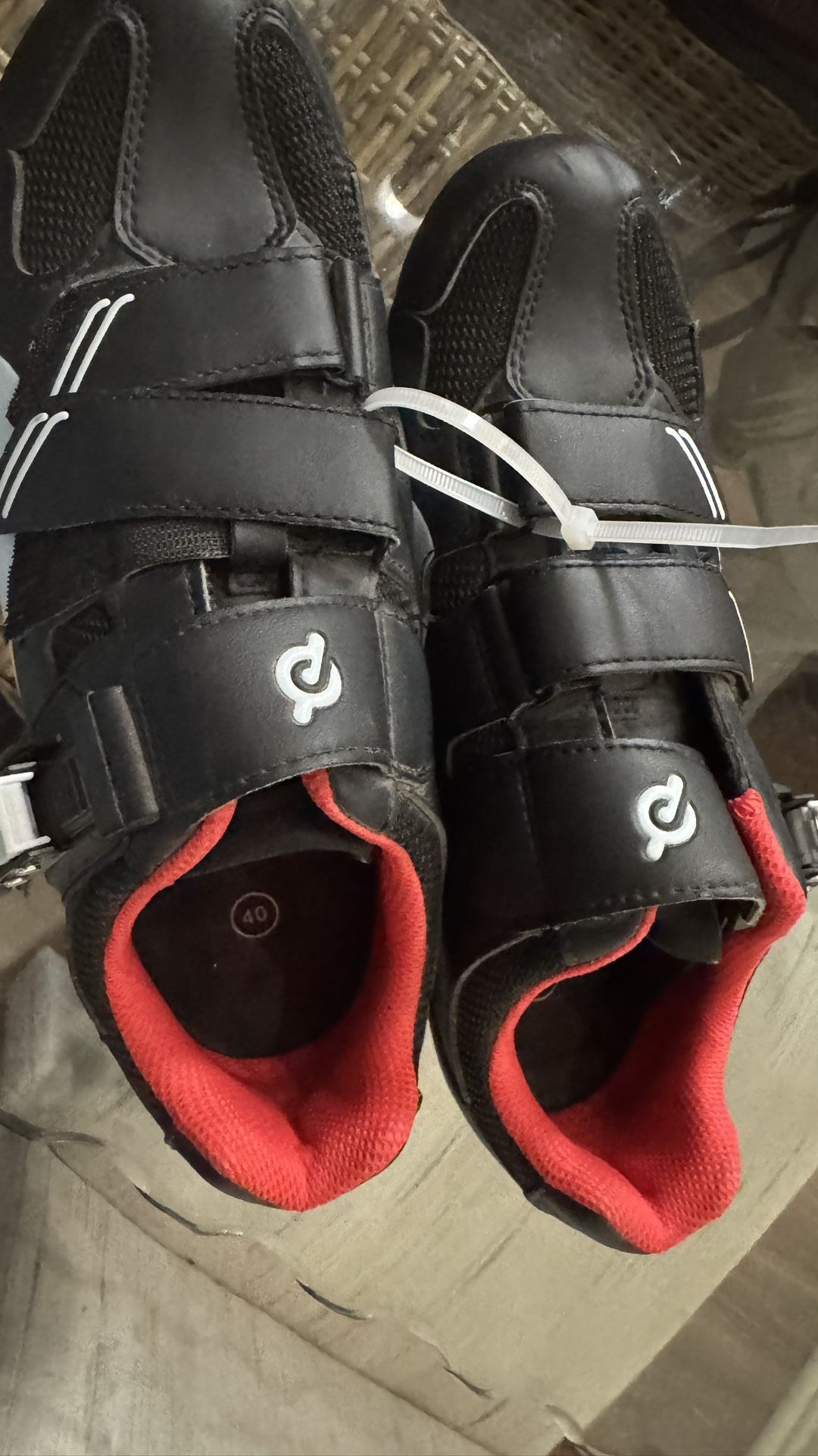Peloton Cycling Shoes, specifically a black pair with red interior and a size 40