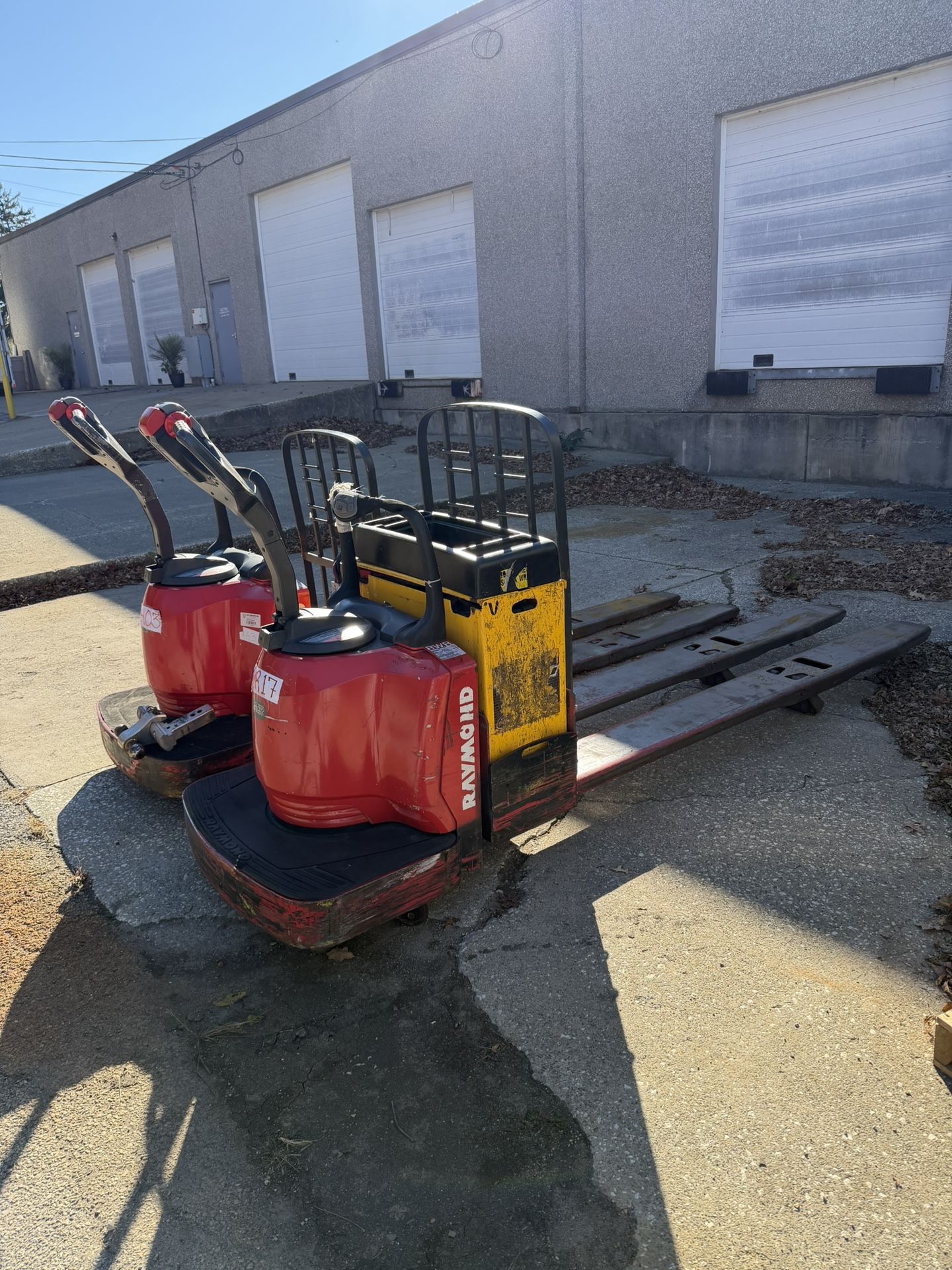 2 × Raymond 8410 Electric Pallet Jacks + Ametek LTD Charger – 6,000 lb Each