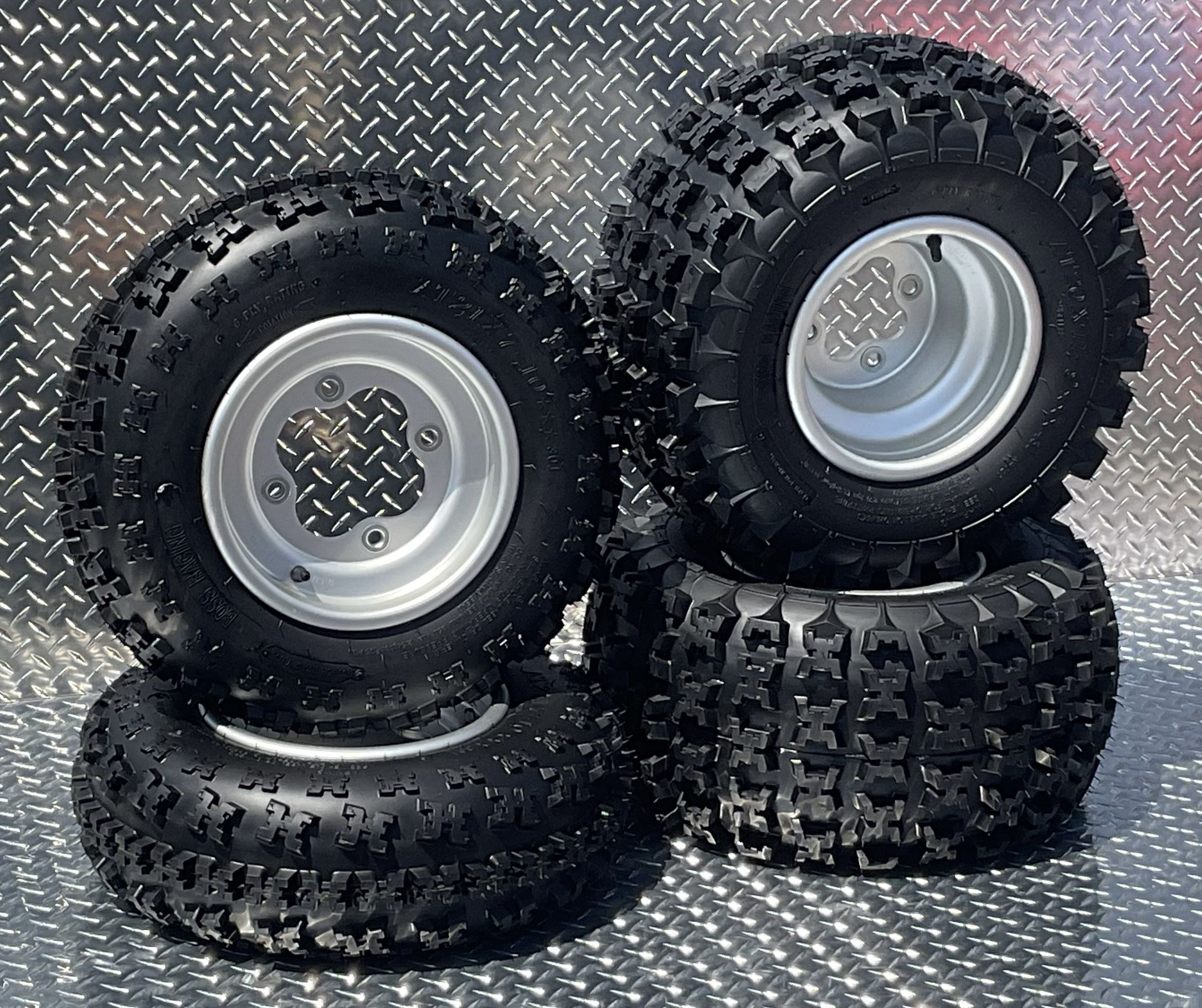 Honda Suzuki Kawasaki Stock Oem did Honda wheels with 21x7-10 and 20x11-9 6 ply boss racing tires bolt pattern 4-110 rear and 4-144 front $