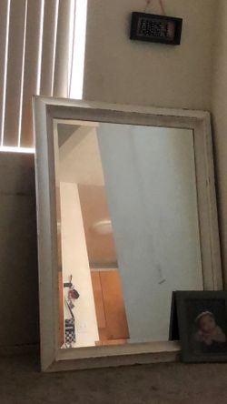 Almost 4 feet tall high white mirror hanging too on wall or free standing perfect condition no cracks in mirror